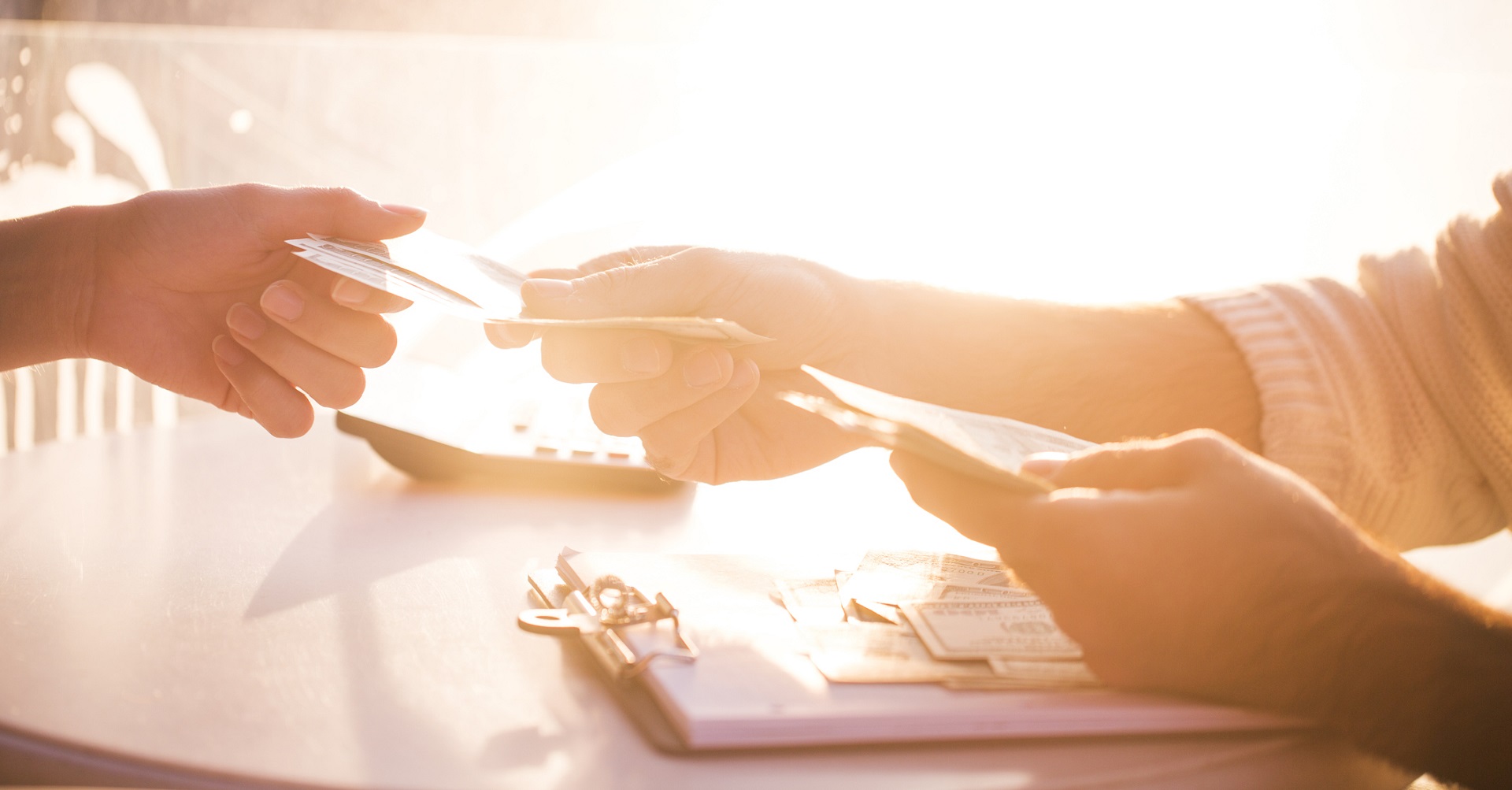 woman handing over money to someone