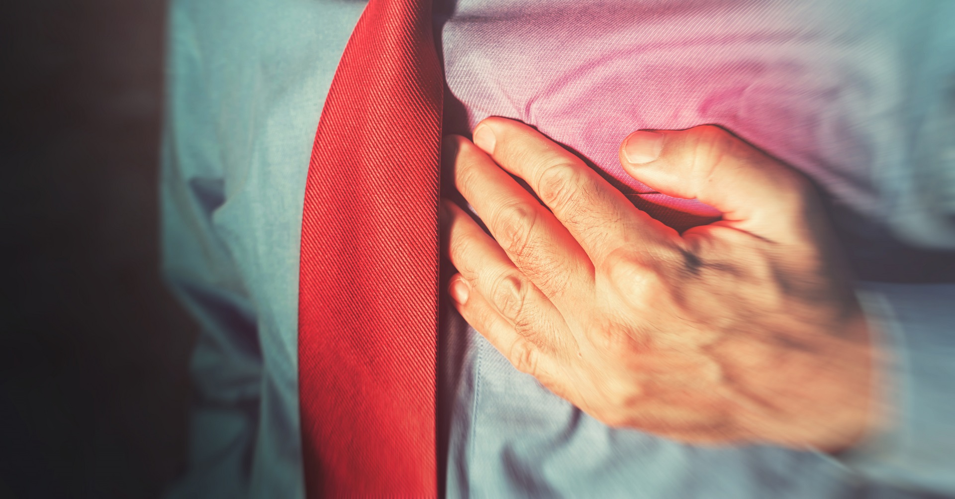 Businessman with hand on heart