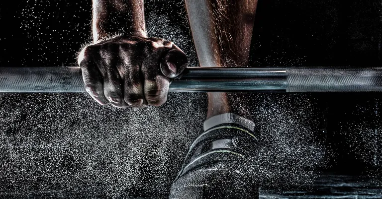 man lifting weights
