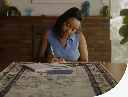 woman writing at table