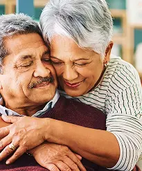 elderly couple embracing