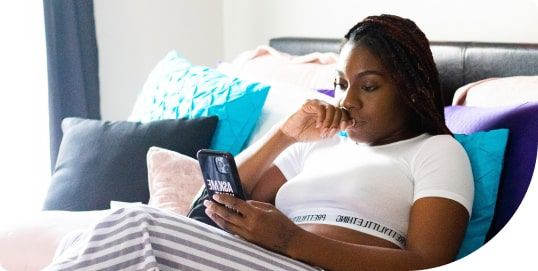 Woman on couch with phone