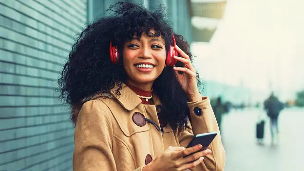 smiling lady wearing headphones