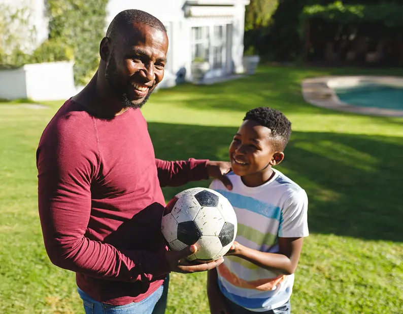 father and son playing ball
