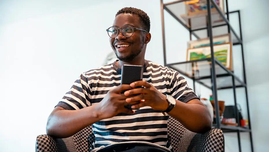 guy on couch using phone