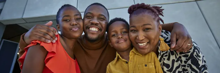 Family of four smiling