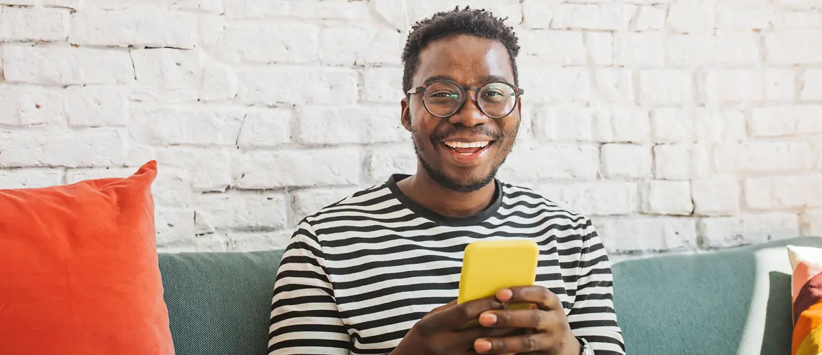 guy holding yellow smart phone
