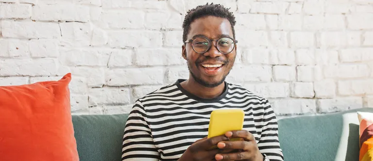 guy holding yellow smart phone