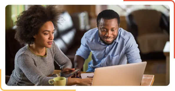 two people discussing over laptop